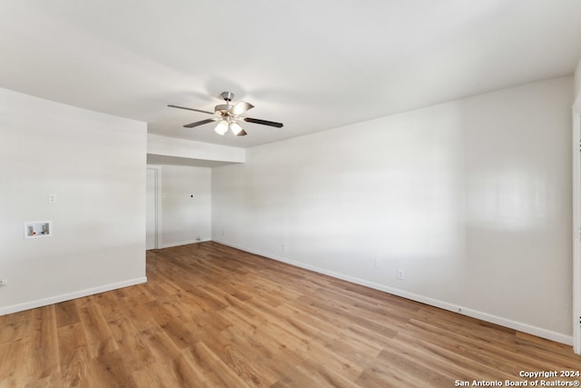 unfurnished room featuring light hardwood / wood-style floors and ceiling fan