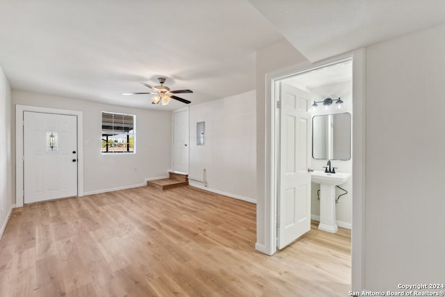 interior space with light hardwood / wood-style floors and ceiling fan