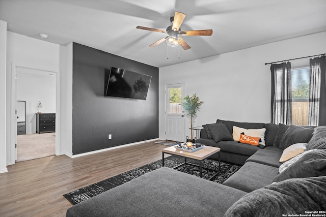 living room featuring hardwood / wood-style flooring and ceiling fan