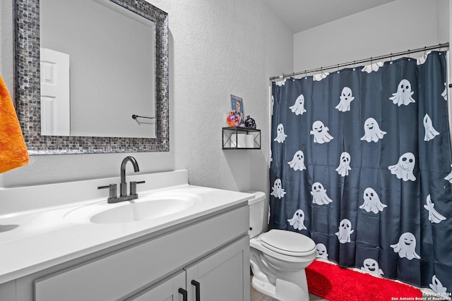 3311 Marshy Oak, San Antonio, TX 78223 - bathroom with a textured wall, vanity, toilet, a shower with shower curtain, and wood finished floors