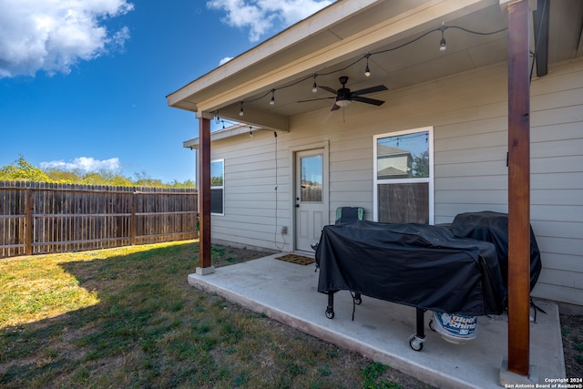 exterior space featuring a grill and ceiling fan