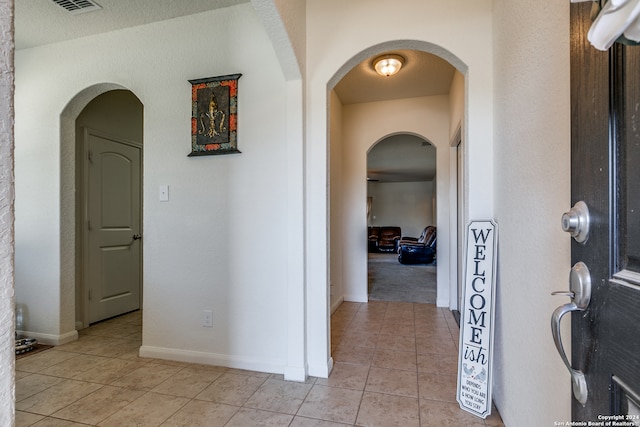 hallway with light tile patterned flooring