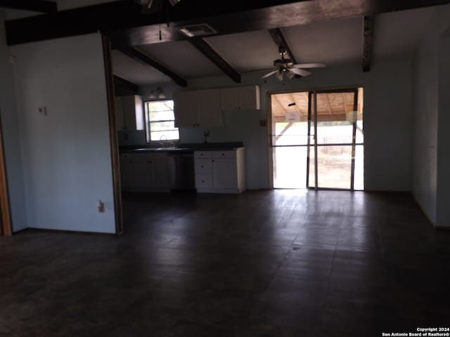 kitchen with sink, vaulted ceiling with beams, dishwashing machine, and ceiling fan