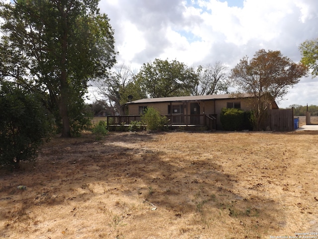 rear view of property with a deck