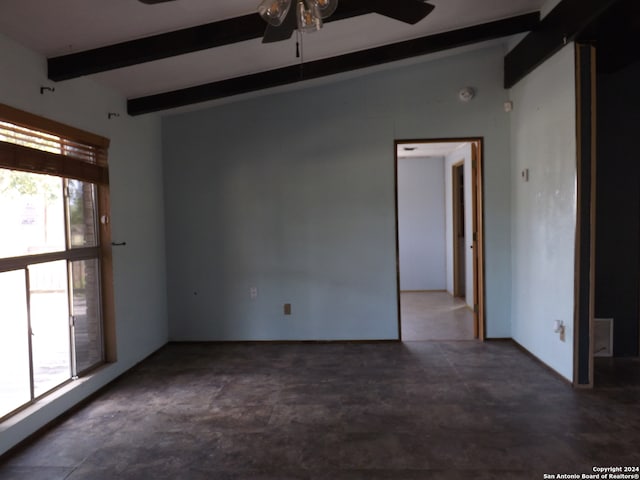 empty room with ceiling fan and vaulted ceiling with beams