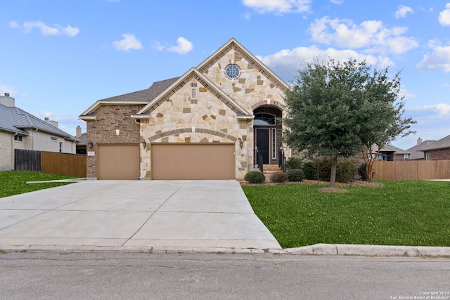 view of front facade with a front lawn and a garage