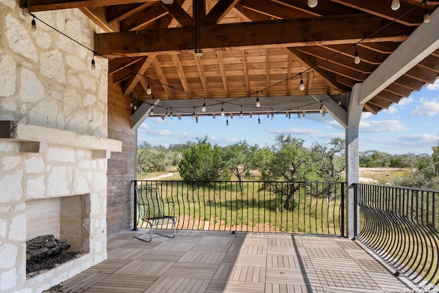 view of patio featuring a balcony and a gazebo