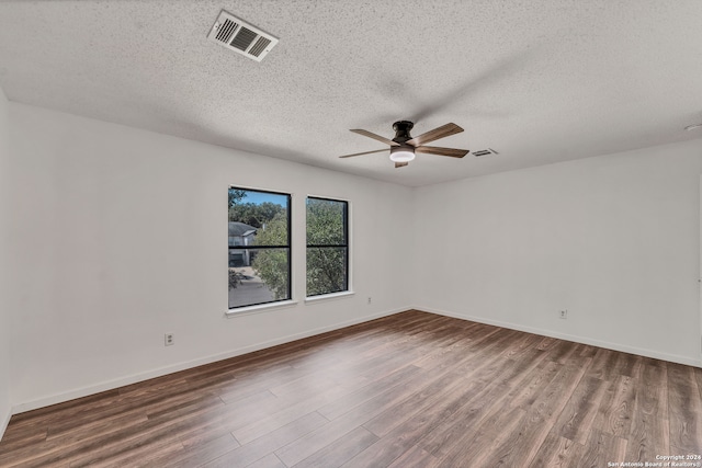 unfurnished room with a textured ceiling, hardwood / wood-style flooring, and ceiling fan