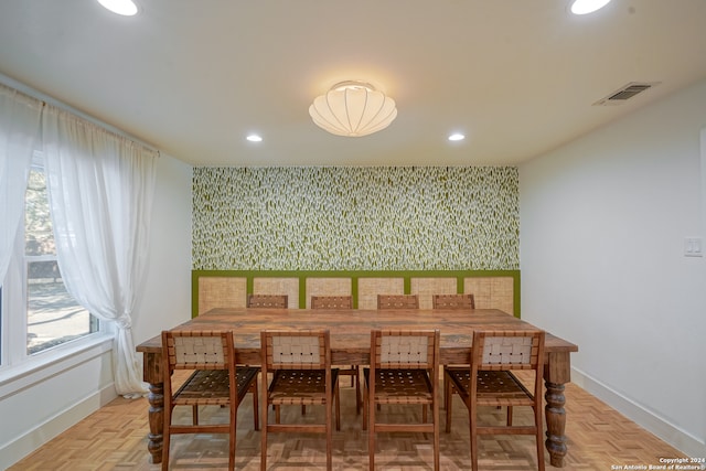 dining room with light parquet floors