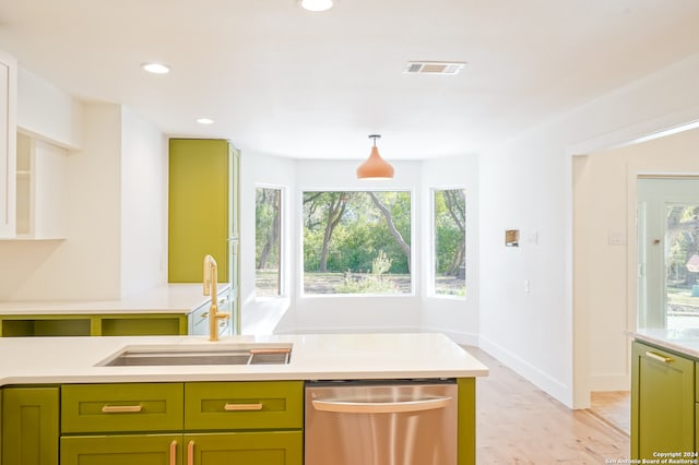 kitchen with a healthy amount of sunlight, sink, light wood-type flooring, and dishwasher