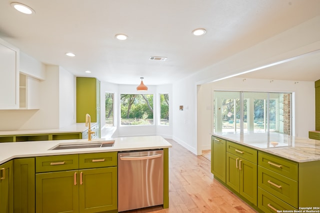 kitchen with dishwasher, sink, green cabinetry, light wood-type flooring, and light stone counters