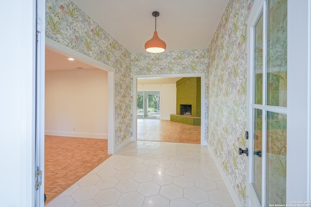 hallway featuring light parquet flooring