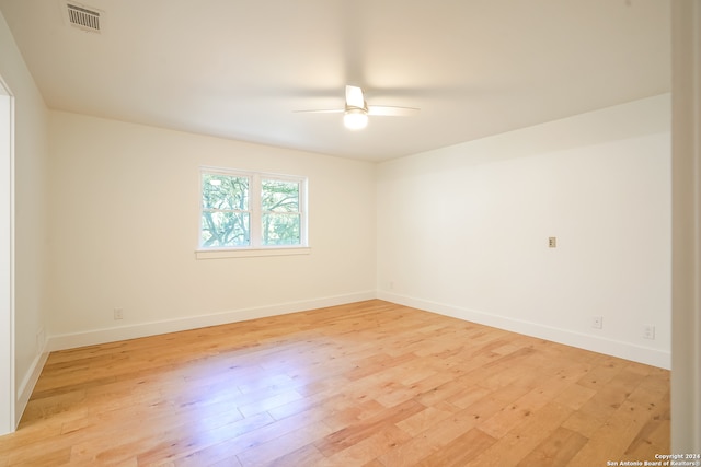 unfurnished room featuring ceiling fan and light hardwood / wood-style flooring