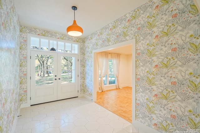 doorway to outside featuring french doors and light parquet floors