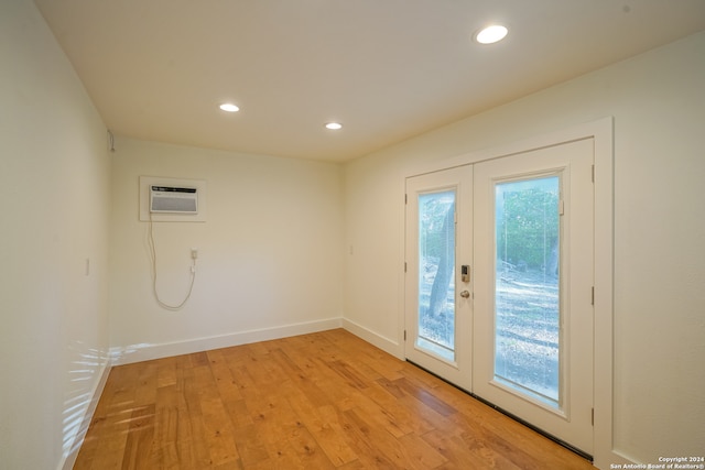 doorway featuring a wealth of natural light, french doors, and light wood-type flooring