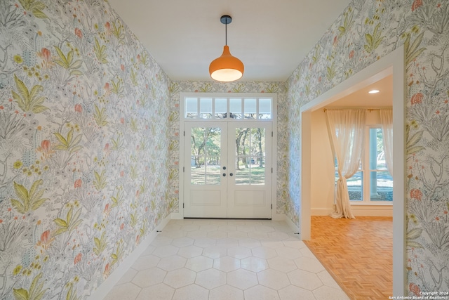 entryway featuring french doors and light parquet floors