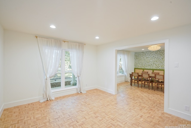 unfurnished room with light parquet floors