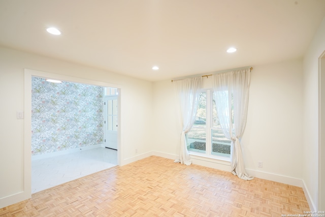 spare room with light parquet flooring