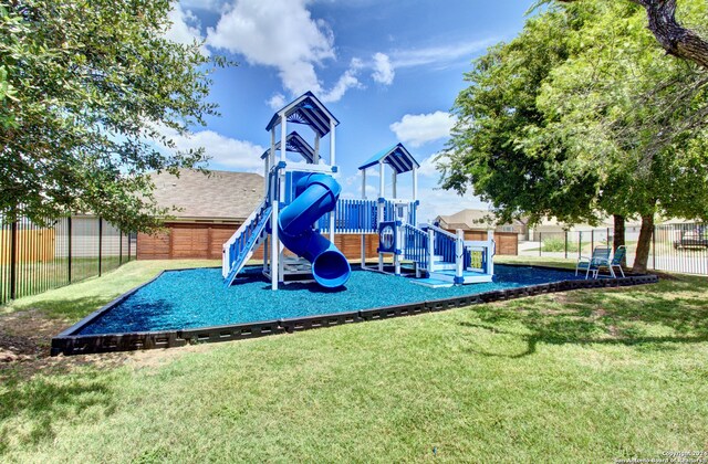 view of playground with a yard