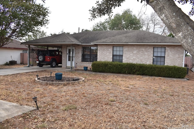 ranch-style home with a carport