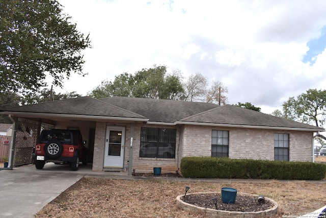 single story home featuring a carport