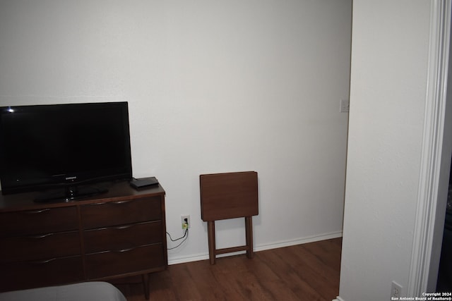 bedroom featuring dark hardwood / wood-style flooring