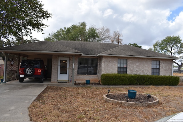 ranch-style house featuring a carport