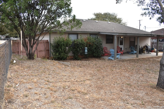 back of house with a patio