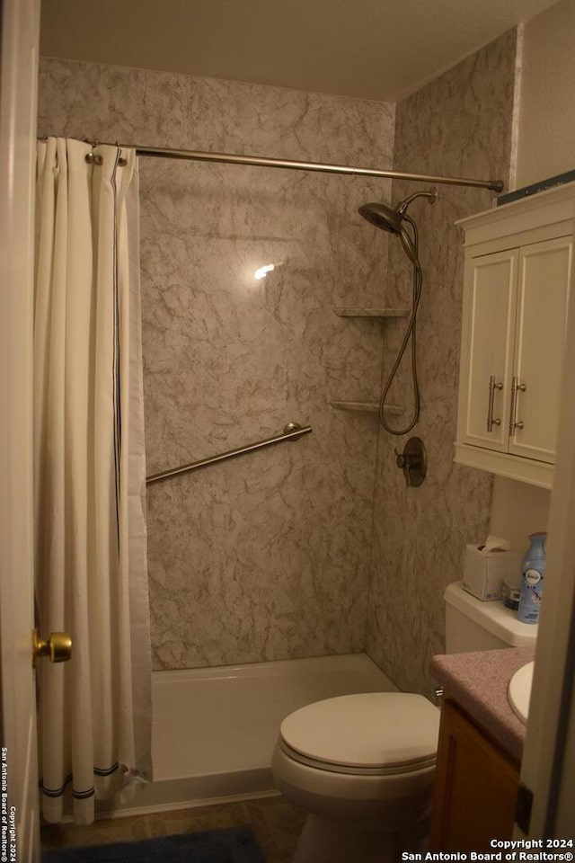 bathroom featuring vanity, a shower with curtain, and toilet