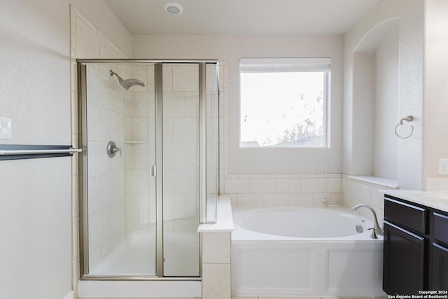 bathroom featuring independent shower and bath and vanity