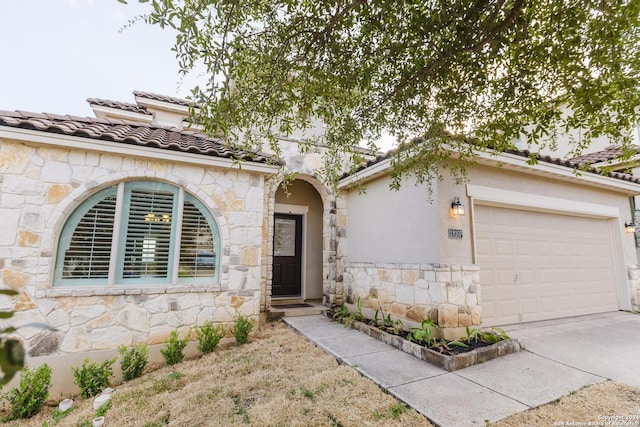 view of front of property with a garage