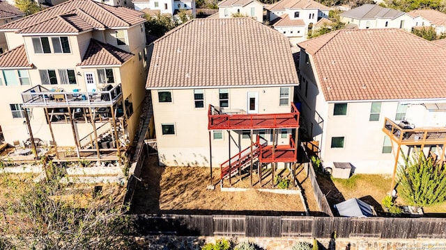 rear view of house with a wooden deck