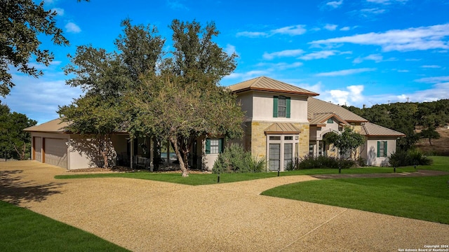 view of front facade with a front lawn and a garage