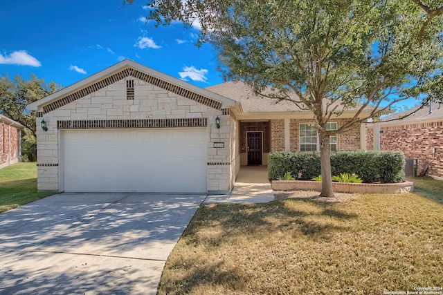 ranch-style home featuring a front yard and a garage