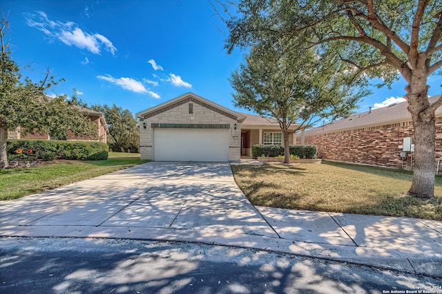 ranch-style home with a front lawn and a garage