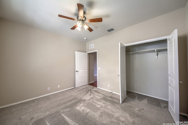 unfurnished bedroom with a closet, ceiling fan, and carpet flooring