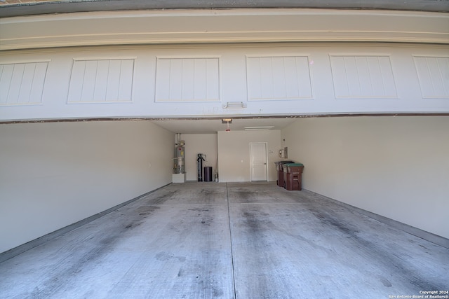 garage featuring secured water heater