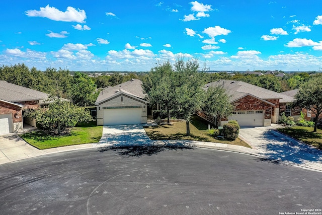 single story home featuring a front yard and a garage