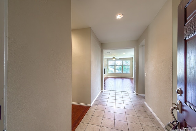 hallway with light tile patterned floors