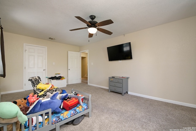 carpeted bedroom with ceiling fan