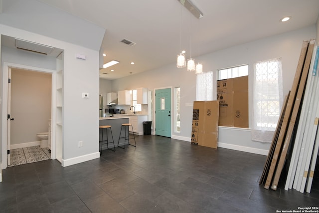 tiled foyer with sink