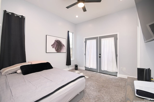 bedroom with french doors, light colored carpet, and ceiling fan