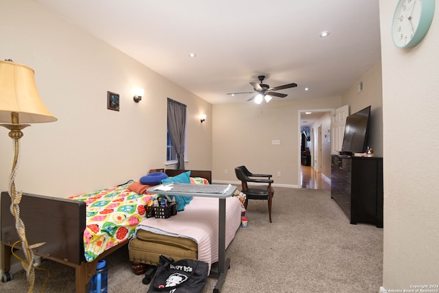 living room featuring light colored carpet and ceiling fan