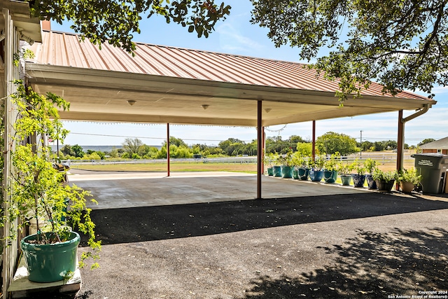 view of vehicle parking with a carport