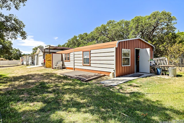 exterior space featuring a shed and a lawn