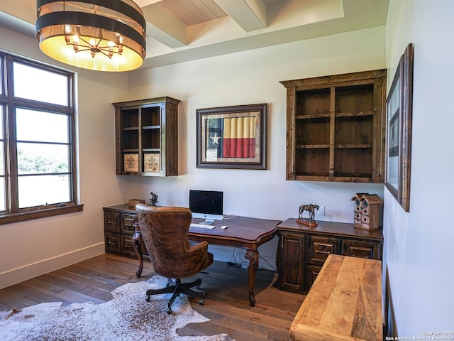 home office featuring dark wood-type flooring and beamed ceiling