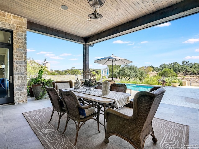 view of patio featuring ceiling fan