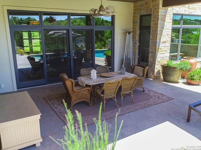 view of patio featuring ceiling fan