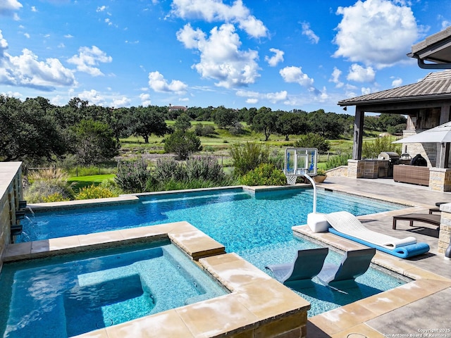 view of swimming pool featuring pool water feature, a patio area, a gazebo, and an in ground hot tub