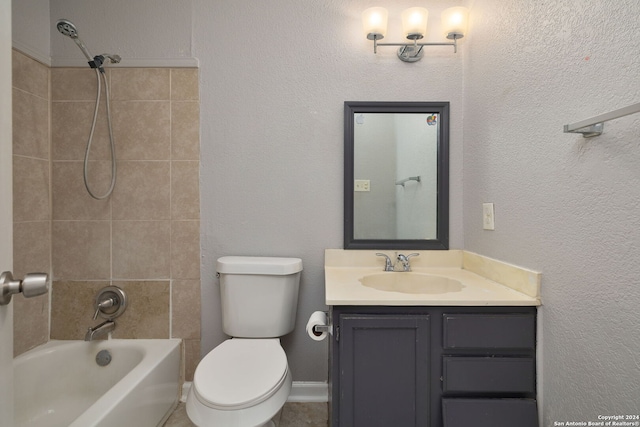 full bathroom with toilet, tiled shower / bath combo, and vanity